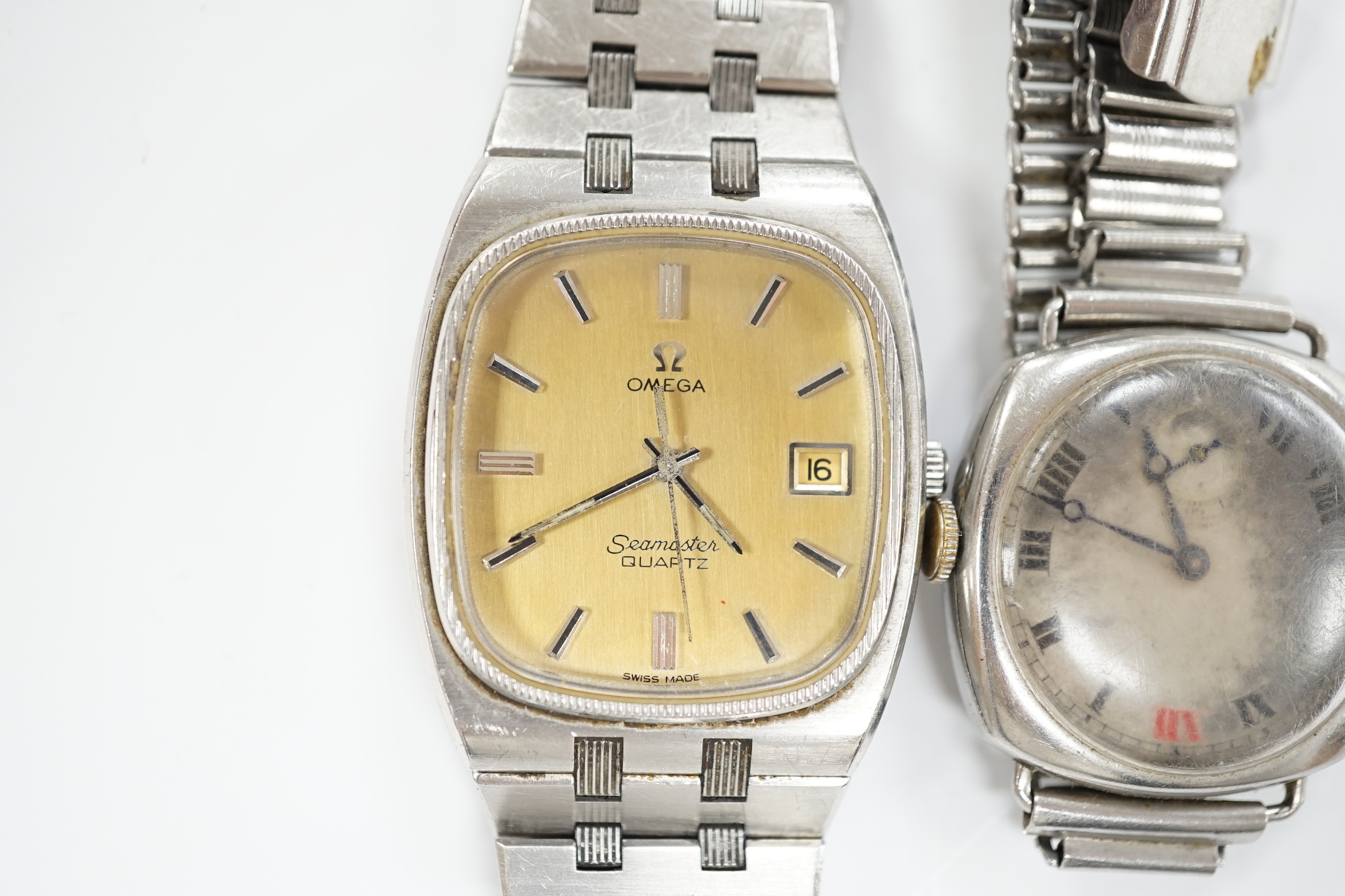 A gentleman's stainless steel Omega Seamaster quartz wrist watch, on Omega bracelet, no box or papers and a gentleman's early 20th century steel Longines manual wind wrist watch.